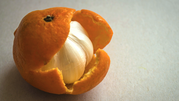 Onion inside a tangerine peel