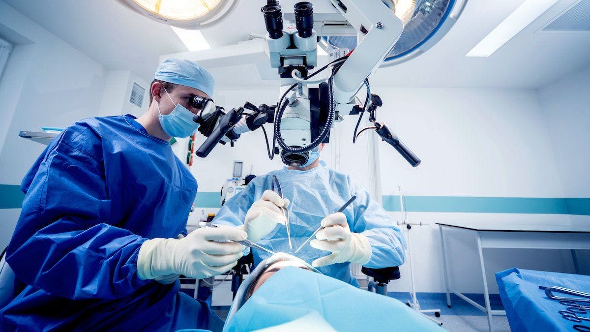 Surgeons performing brain surgery 